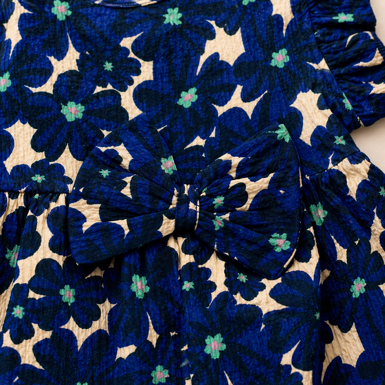 Baby Girls Cotton Dress – Navy Blue Floral Print Dress with Bow & Ruffle Sleeves