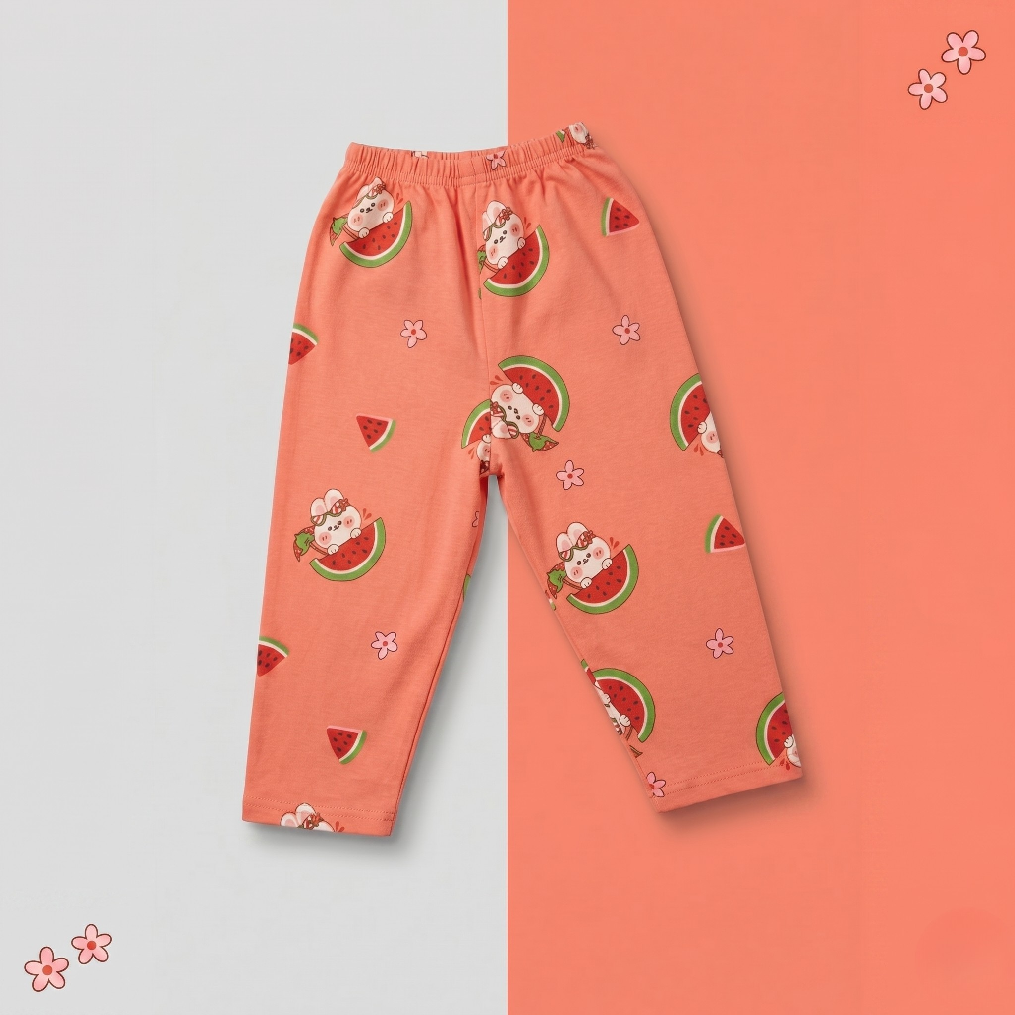 Pajama pants with watermelon and cat pattern on a light gray and orange background